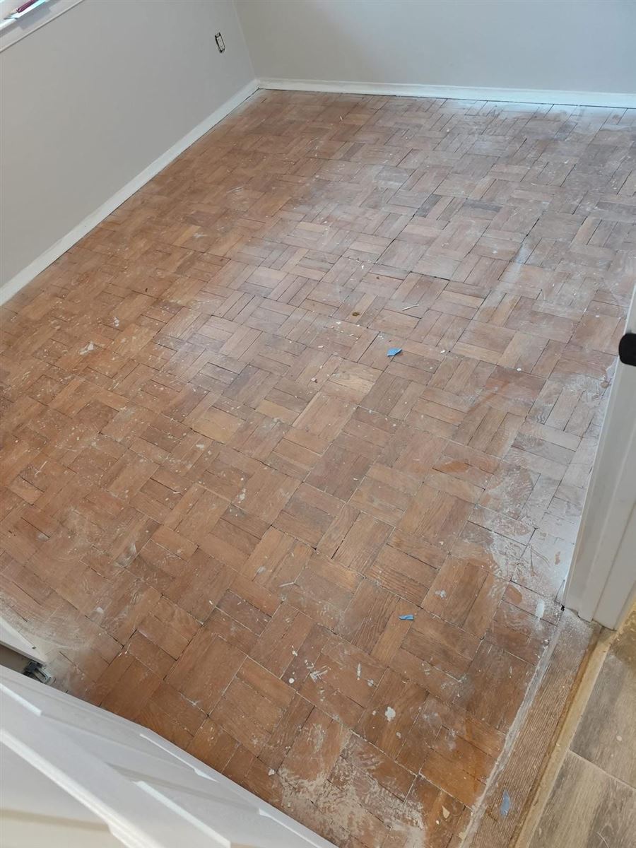 Dull, scuffed parquet floor before refinishing